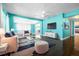 Cozy living room features an open floor plan, hardwood floors, and large windows for natural light at 4732 W Wyoming Ave, Tampa, FL 33616