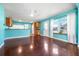 Bright open-concept living area flowing into kitchen, with hardwood floors and modern lighting at 4732 W Wyoming Ave, Tampa, FL 33616
