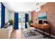 Bright home office with exposed brick wall, walk-out to garden and neutral color accents at 4732 W Wyoming Ave, Tampa, FL 33616