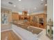Spacious kitchen featuring granite countertops, stainless steel appliances, and ample cabinet space at 4848 Quill Ct, Palm Harbor, FL 34685