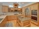 Bright kitchen featuring wooden cabinetry, stainless steel appliances, and a center island at 4848 Quill Ct, Palm Harbor, FL 34685