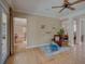 Cozy seating area with hardwood floors, stylish decor, and open access to adjoining rooms at 4848 Quill Ct, Palm Harbor, FL 34685