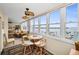 Relaxing sunroom boasts stunning waterfront views and a cozy dining area with ample natural light at 5108 Brittany S Dr # 607, St Petersburg, FL 33715
