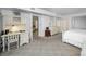 Carpeted bedroom with built-in desk and access to a walk-in closet and bathroom at 5108 Brittany S Dr # 607, St Petersburg, FL 33715