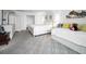 Bright bedroom with carpet flooring, two beds, and white furniture at 5108 Brittany S Dr # 607, St Petersburg, FL 33715