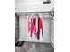 Walk-in closet with clothing on hangers on rod with some items stacked in the corner at 5108 Brittany S Dr # 607, St Petersburg, FL 33715