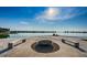A community waterfront area featuring a fire pit with built in benches at 5108 Brittany S Dr # 607, St Petersburg, FL 33715
