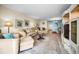 Comfortable living room with sofas, display shelves, and a patterned area rug at 5108 Brittany S Dr # 607, St Petersburg, FL 33715