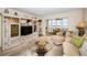 Bright living room with comfortable furniture, water views, and a unique glass table at 5108 Brittany S Dr # 607, St Petersburg, FL 33715