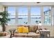 Waterfront views from this living space featuring a comfortable couch and natural lighting at 5108 Brittany S Dr # 607, St Petersburg, FL 33715