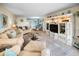 Spacious living room featuring comfortable seating, display cabinet, and large area rug at 5108 Brittany S Dr # 607, St Petersburg, FL 33715