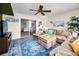 Inviting living area with sliding glass doors, leading to waterfront views and natural light at 5108 Brittany S Dr # 607, St Petersburg, FL 33715