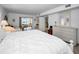 Bright main bedroom featuring a private balcony with scenic water views and coastal decor at 5108 Brittany S Dr # 607, St Petersburg, FL 33715