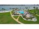 Resort-style community pool with beach access, lush landscaping, and lounge seating for ultimate relaxation at 5108 Brittany S Dr # 607, St Petersburg, FL 33715