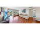 Comfortable living room with wood floors, neutral walls, comfortable sofas, and an outdoor view at 5150 10Th N Ave # 310A, St Petersburg, FL 33710