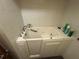 Accessible walk-in tub with white tile walls in bathroom at 5720 13Th N Ave # 106B, St Petersburg, FL 33710