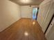 This spacious bedroom features wood-look flooring and ample closet space at 5720 13Th N Ave # 106B, St Petersburg, FL 33710