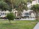 Outdoor seating area for the community has chairs, tables and various greenery at 5720 13Th N Ave # 106B, St Petersburg, FL 33710