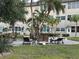 Outdoor seating area near residential buildings surrounded by lush tropical landscaping at 5720 13Th N Ave # 106B, St Petersburg, FL 33710