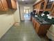 Outdated kitchen area with vintage cabinets and green tile countertops at 5720 13Th N Ave # 106B, St Petersburg, FL 33710
