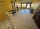 Spacious living area with tile floors, yellow walls and multiple windows for ample light at 5720 13Th N Ave # 106B, St Petersburg, FL 33710