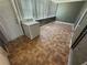 Sunroom featuring tile flooring and a washer, illuminated by natural light at 5720 13Th N Ave # 106B, St Petersburg, FL 33710