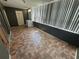 Enclosed sunroom featuring tiled floors, large windows and laundry hookups at 5720 13Th N Ave # 106B, St Petersburg, FL 33710