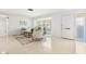 Bright living room with terrazzo flooring, a bay window and cozy furnishings at 6160 29Th N Ave, St Petersburg, FL 33710