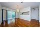 Dining area with hardwood floors, chandelier, and sliding glass doors to the outside deck at 70 Ashley Ln, Oldsmar, FL 34677