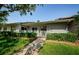 Charming home exterior with well-maintained landscaping, a picket fence, and a welcoming front porch at 70 Ashley Ln, Oldsmar, FL 34677