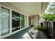 This covered patio is accessible from the house and features a sliding glass door entry at 70 Ashley Ln, Oldsmar, FL 34677