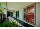 This covered patio is accessible from the living room and features a sliding glass door entry at 70 Ashley Ln, Oldsmar, FL 34677