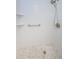 Newly renovated walk-in shower with white subway tile and mosaic floor for a modern spa-like experience at 70 Ashley Ln, Oldsmar, FL 34677