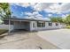 Charming single-story home with a covered parking and a well-maintained exterior at 7201 N Grady Ave, Tampa, FL 33614