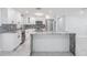 Modern kitchen showcasing a large island with granite countertops and stainless steel appliances at 7201 N Grady Ave, Tampa, FL 33614