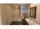 Bathroom featuring shower-tub combo and single-sink vanity at 7530 Red Mill Cir, New Port Richey, FL 34653