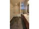 Bathroom view with shower/tub combo and vanity with granite counter at 7530 Red Mill Cir, New Port Richey, FL 34653
