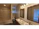 Bathroom with double sink vanity, tub, and shower combo at 7530 Red Mill Cir, New Port Richey, FL 34653