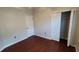 Bedroom showcasing wood laminate flooring and closet space at 7530 Red Mill Cir, New Port Richey, FL 34653