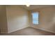 Clean bedroom showcasing carpet and a window with blinds at 7530 Red Mill Cir, New Port Richey, FL 34653