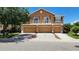 Townhouse with multiple garages, balconies, well-kept lawn, and inviting curb appeal at 7530 Red Mill Cir, New Port Richey, FL 34653
