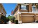Charming townhome with an attached garage, neat landscaping, and American flag waving out front at 7530 Red Mill Cir, New Port Richey, FL 34653