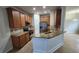 Well-lit kitchen featuring granite countertops, stainless steel appliances, and wooden cabinets at 7530 Red Mill Cir, New Port Richey, FL 34653
