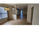 Bright living room featuring tile floors and large windows for natural light, creating a welcoming atmosphere at 7530 Red Mill Cir, New Port Richey, FL 34653