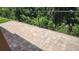 Outdoor patio with charming brick pavers and views of mature landscaping at 7530 Red Mill Cir, New Port Richey, FL 34653