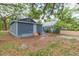 Home exterior with a yard and mature trees at 8008 N Alaska St, Tampa, FL 33604