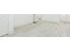 Bedroom featuring white hardwood floors and a view of the bathroom at 8008 N Alaska St, Tampa, FL 33604