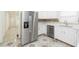 Modern kitchen featuring stainless steel appliances and white cabinetry at 8008 N Alaska St, Tampa, FL 33604