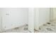 Bright laundry room area with patterned tile flooring and white walls at 8008 N Alaska St, Tampa, FL 33604