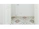 Bright laundry room area with patterned tile flooring and white walls at 8008 N Alaska St, Tampa, FL 33604